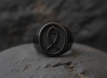 Side angle view of handcrafted religious fish ring showing black rhodium plating and sterling silver band detail