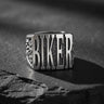 925 sterling silver biker ring with raised BIKER lettering displayed on textured black stone surface