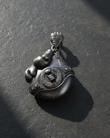 Side angle view of boxing pendant showing detailed rope texture and three-dimensional craftsmanship