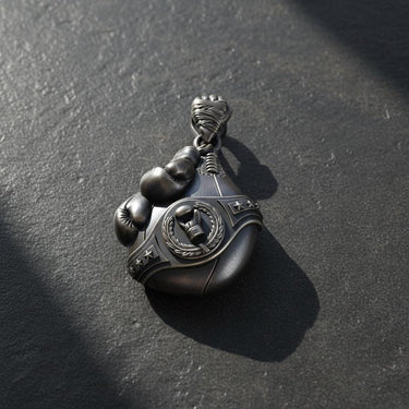 Side angle view of boxing pendant showing detailed rope texture and three-dimensional craftsmanship