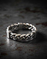 925 sterling silver chunky rope ring with twisted braided design displayed on dark stone surface