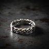925 sterling silver chunky rope ring with twisted braided design displayed on dark stone surface