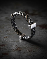 Close-up detail of twisted knot pattern on chunky sterling silver rope ring displaying artisanal craftsmanship and texture