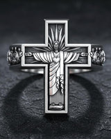 Close-up of handcrafted religious cross ring displaying intricate metalwork and spiritual symbolism details