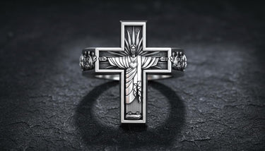 Close-up of handcrafted religious cross ring displaying intricate metalwork and spiritual symbolism details