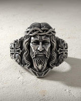 Front view of handcrafted Jesus Christ ring displaying oxidized finish and intricate religious metalwork