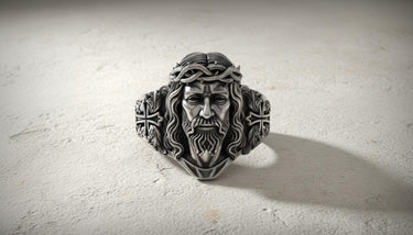 Front view of handcrafted Jesus Christ ring displaying oxidized finish and intricate religious metalwork