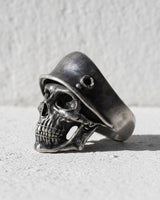 Side profile view of handcrafted soldier skull ring showing helmet details and oxidized silver finish quality