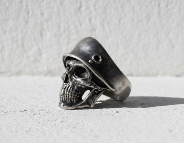 Side profile view of handcrafted soldier skull ring showing helmet details and oxidized silver finish quality