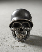 Close-up front angle of military helmet skull ring highlighting intricate metalwork and sterling silver craftsmanship