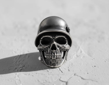 925 sterling silver soldier skull ring with military helmet displayed on textured white surface showing front view