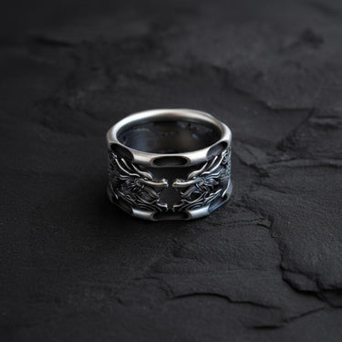 Side angle view of handcrafted dragon ring showing intricate scale details and band cutout design