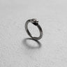 925 sterling silver ouroboros snake ring with detailed scales and oxidized finish displayed on white textured background