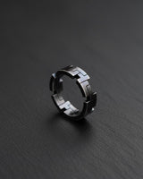 Close-up view of sterling silver geometric ring highlighting precise angular cuts and polished finish details