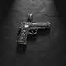 925 sterling silver gun pendant with ornate baroque engravings displayed on dark textured background