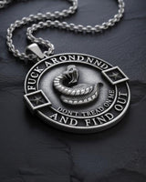 Close-up view of Don't Tread On Me pendant showing intricate snake scales and raised lettering detail