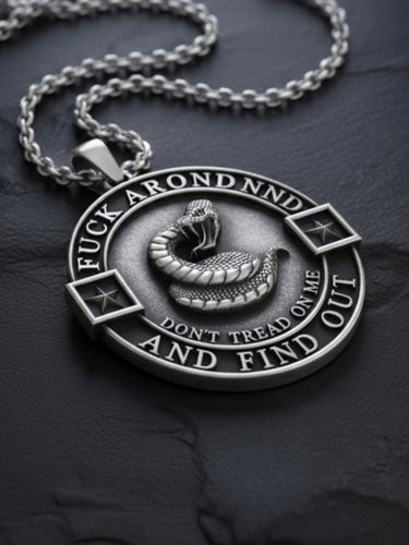 Close-up view of Don't Tread On Me pendant showing intricate snake scales and raised lettering detail