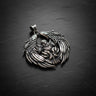 925 sterling silver bald eagle pendant with spread wings and detailed feathers on dark slate background