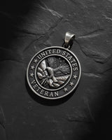 Close-up of military veteran pendant showing intricate eagle craftsmanship and seven stars surrounding patriotic design