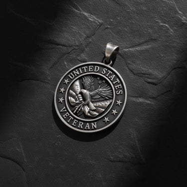 Close-up of military veteran pendant showing intricate eagle craftsmanship and seven stars surrounding patriotic design