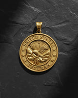 925 sterling silver veteran pendant with gold vermeil finish showing American eagle and flag design on slate background