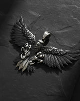 925 sterling silver American eagle pendant with spread wings and detailed feathers on dark stone background