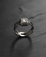 Close-up of sterling silver wireframe ring highlighting intricate geometric patterns and modern minimalist design