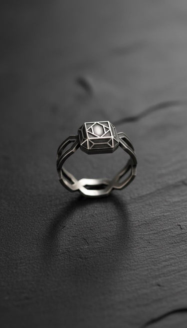 Close-up of sterling silver wireframe ring highlighting intricate geometric patterns and modern minimalist design