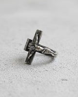 925 sterling silver Jesus cross ring with detailed crucifix and textured cross design on white marble surface
