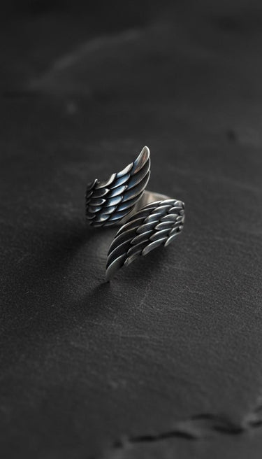 Close-up perspective of sterling silver wings ring showing intricate feather craftsmanship and spiritual symbolism