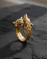 Close-up detail of wolf head design with intricate metalwork and bared fangs on 925 sterling silver ring band