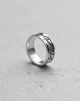 925 sterling silver Aztec ring with Mayan geometric patterns displayed on textured concrete surface showing detail