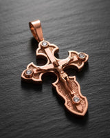 Black oxidized silver crucifix pendant displaying intricate Christian cross metalwork and stone details