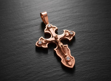 Black oxidized silver crucifix pendant displaying intricate Christian cross metalwork and stone details