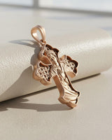 Side view of ornate Catholic cross pendant showing Celtic pattern details and rose gold finish quality