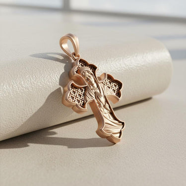 Side view of ornate Catholic cross pendant showing Celtic pattern details and rose gold finish quality