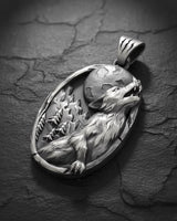 Side angle of handcrafted silver wolf necklace showing thickness and claw mark details on the pendant bail