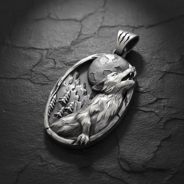 Side angle of handcrafted silver wolf necklace showing thickness and claw mark details on the pendant bail