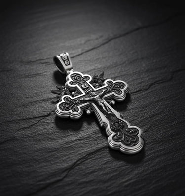 Close-up of sterling silver Russian cross pendant displaying oxidized finish and sacred Orthodox craftsmanship