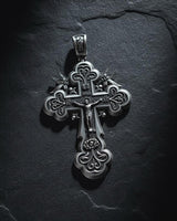 925 sterling silver Orthodox cross pendant with ornate angel details and traditional Russian design on dark slate