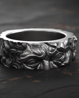 925 sterling silver Moses ring with detailed prophet sculpture and black rhodium finish on dark wooden surface