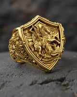 925 sterling silver St George dragon ring with gold vermeil finish showing detailed shield design and knight battle scene