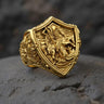 925 sterling silver St George dragon ring with detailed shield design displayed on dark stone surface