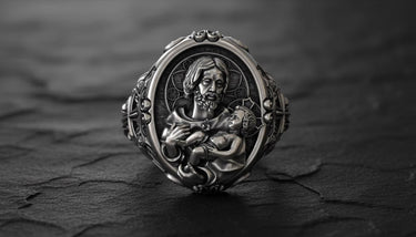 925 sterling silver Saint Joseph ring with baby Jesus in black rhodium finish displayed on dark wooden background