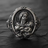 925 sterling silver St Joseph Baby Jesus ring with detailed religious carving and black rhodium finish on wood surface