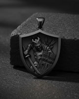 Gold plated samurai shield pendant close-up showing three-dimensional bushido warrior with cherry blossom elements