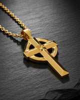Sterling silver Irish cross necklace with gold finish displayed on chain showing dimensional Celtic knotwork