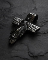 Close-up of Divine Mercy cross pendant highlighting intricate metalwork and dual-tone silver finish