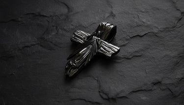 Close-up of Divine Mercy cross pendant highlighting intricate metalwork and dual-tone silver finish