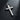 Sterling silver cross pendant with a handcrafted rustic wood grain finish, displayed under a spotlight on a black surface.